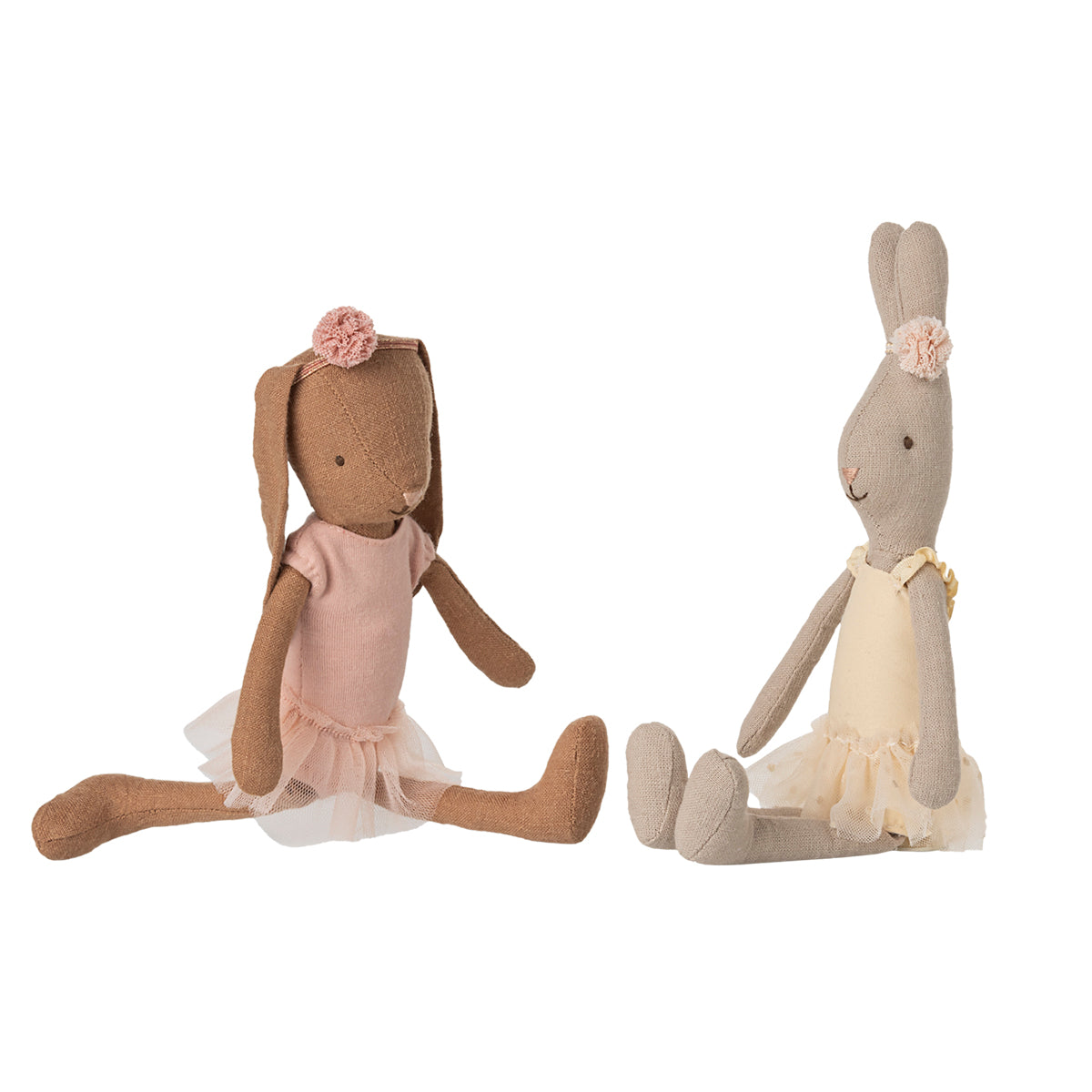 Maileg bunnies striking a pose in their elegant ballet outfits, with floral headbands and tutus.