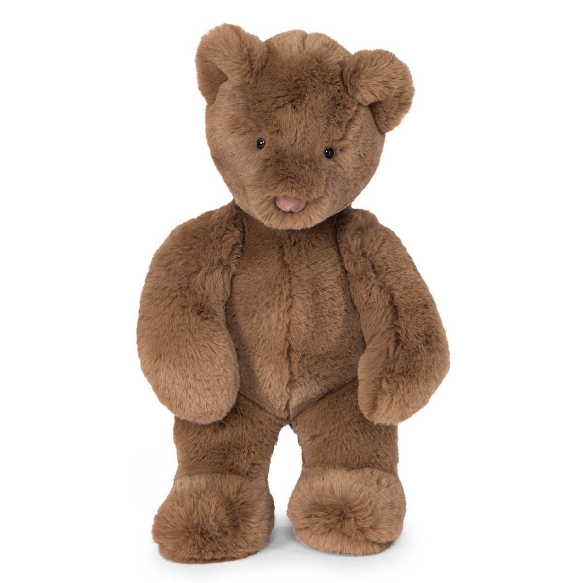 A medium brown, fuzzy teddy bear with small black eyes and a pinkish-brown nose standing against a white background.
