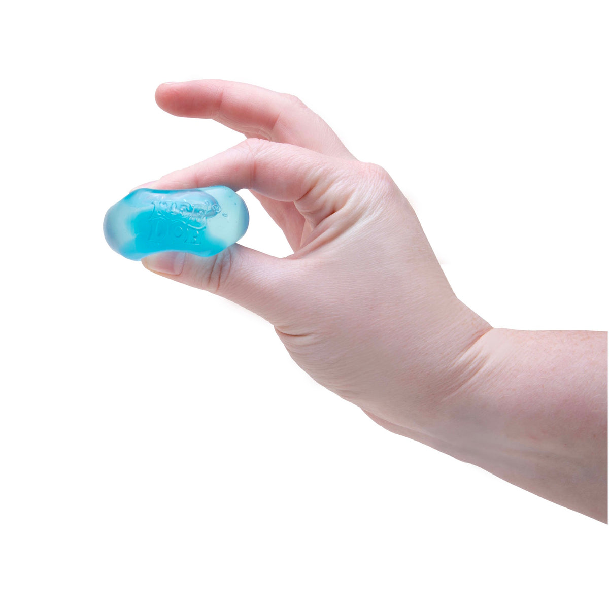 A hand pinches a small, squishy blue ice cube toy labeled NeeDoh against a white background.