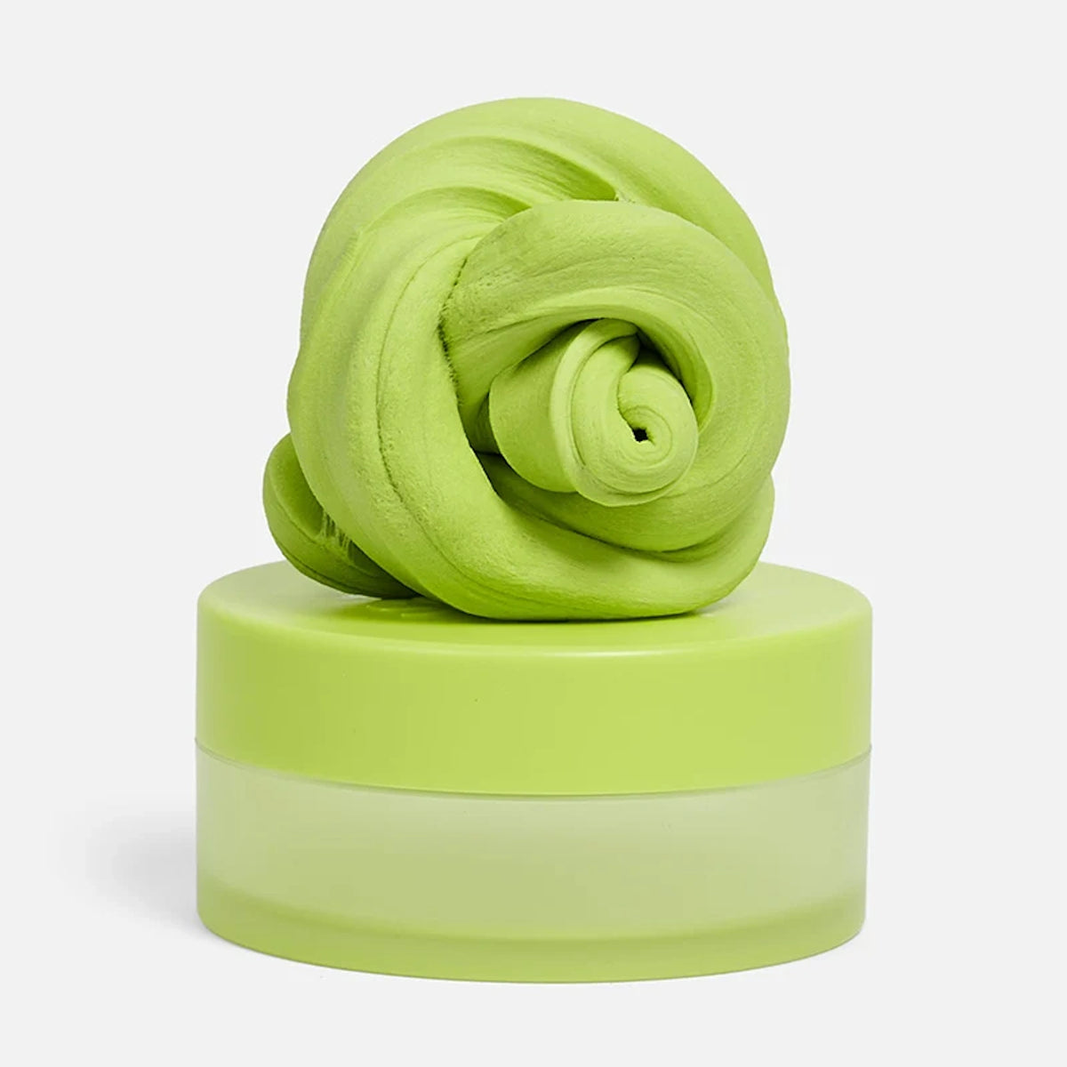 Swirled light-green focus putty resting on top of its matching circular container.