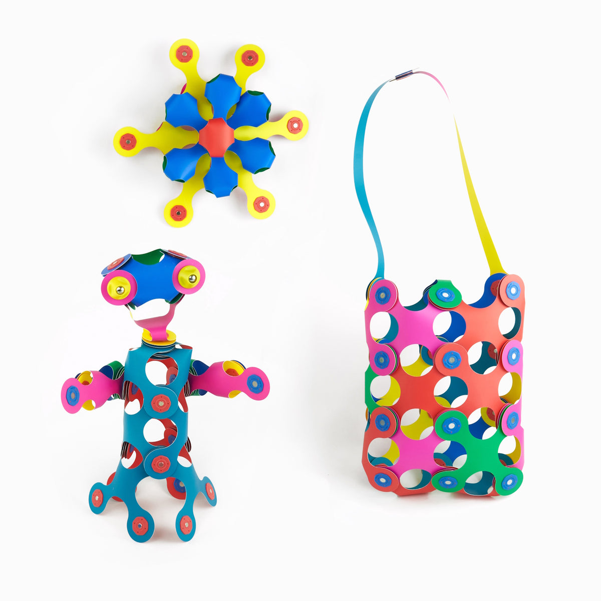 Three colorful creations, a flower star, a small figure, and a shoulder bag, built with Clixo magnetic pieces.