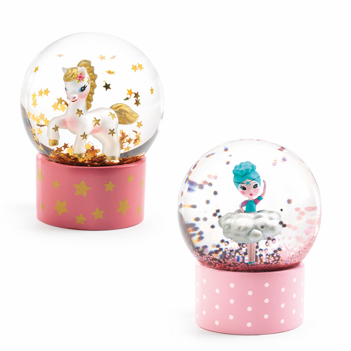 Two Djeco mini snow globes featuring a unicorn with gold stars and a ballerina with pink glitter on pink bases.