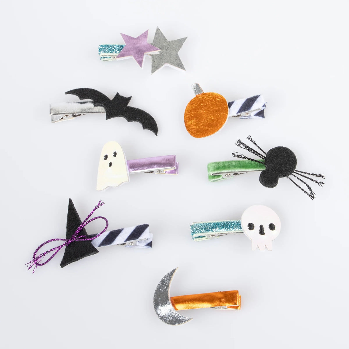 Set of Halloween hair clips featuring a bat, ghost, pumpkin, witch hat, spider, skull, and moon.