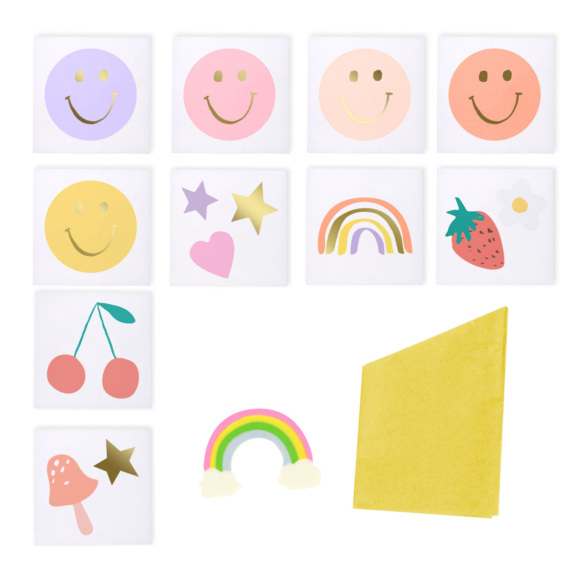 Assorted party surprise ball gifts including temporary tattoos, paper charms, and a folded yellow paper sheet.