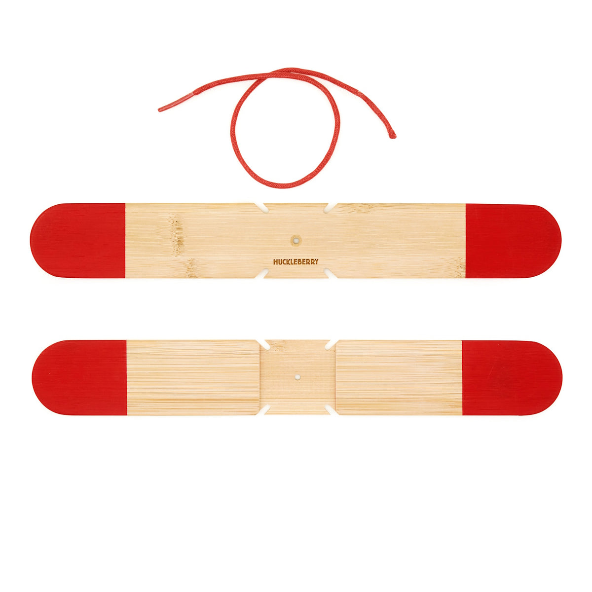 Huckleberry pocket boomerang kit featuring two bamboo sticks with red tips and a red string on a white background.