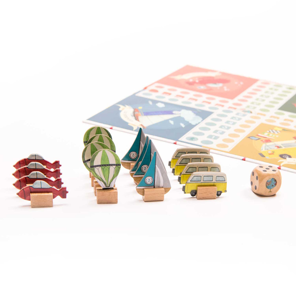 Moulin Roty Les Explorateurs small horses board game pieces showing wooden vehicle pawns dice and colorful game board.
