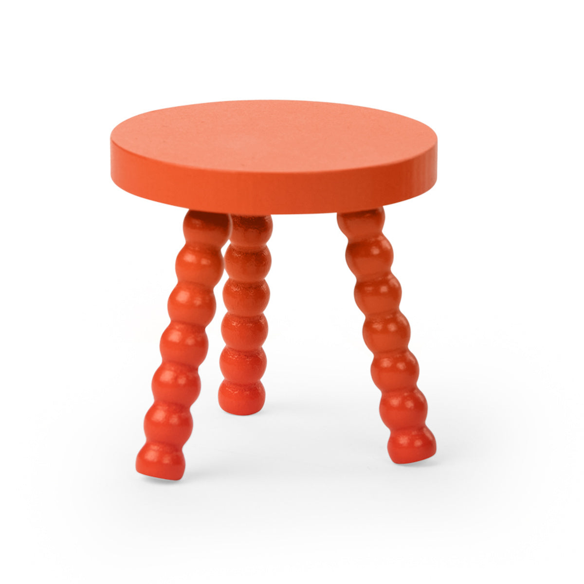 Orange wooden stool with a round top and three bobbin turned legs.
