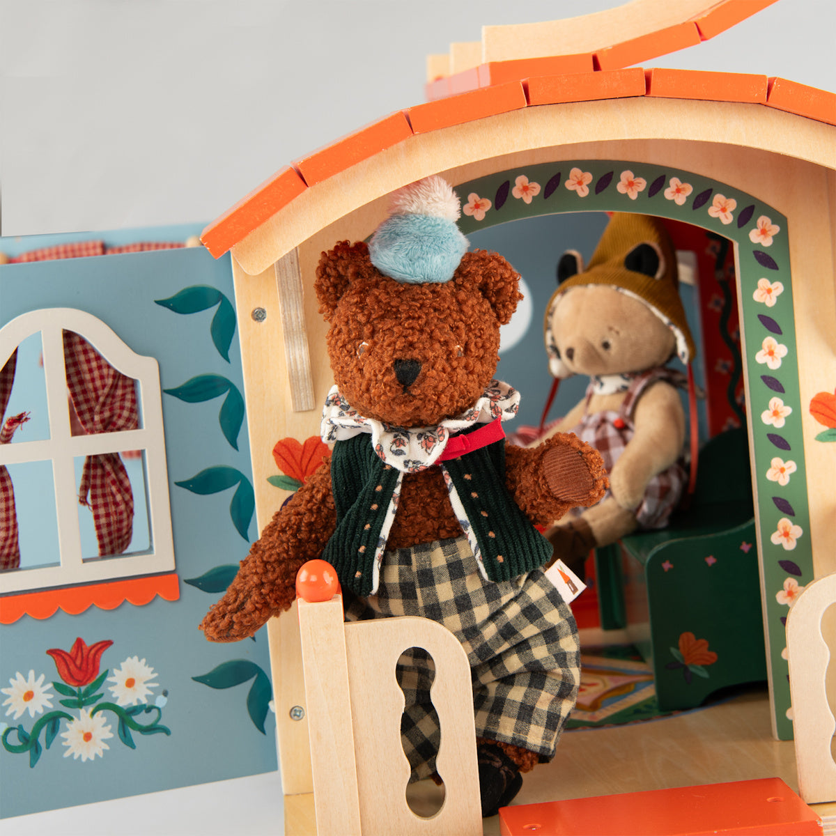 Plush bear and mouse figures playing inside a Les Minouchkas wooden caravan toy.