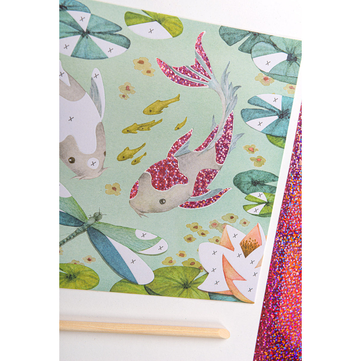 Glitter koi fish art kit with pond design and stylus tool.