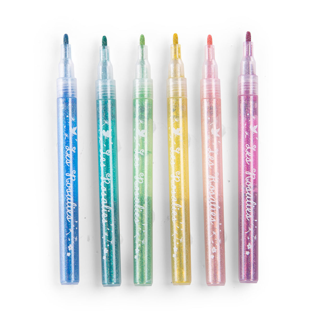Set of six colorful glitter markers lined up horizontally on a white background for arts and crafts.