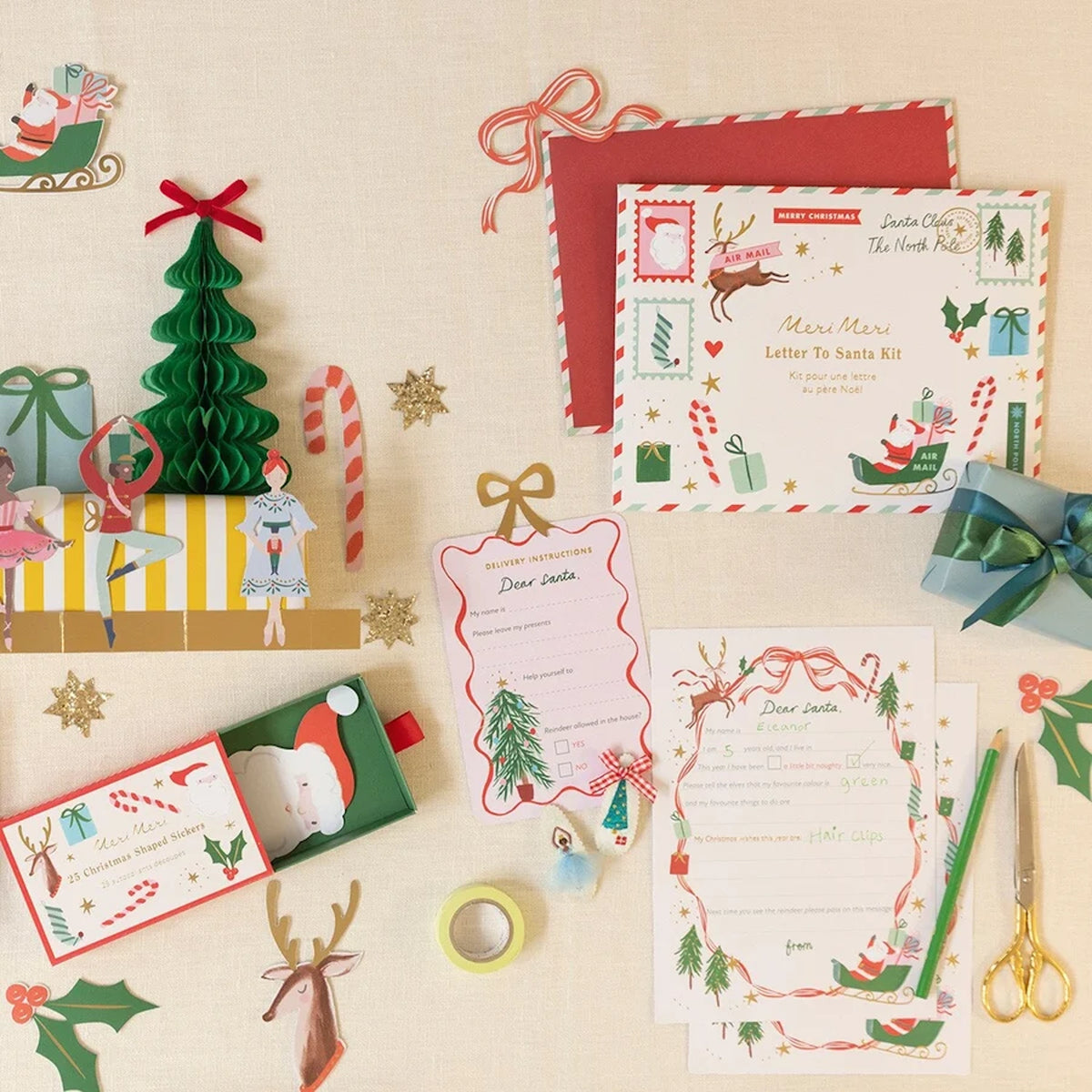 Christmas stationery craft set with letter to Santa, stickers, cutout tree, and decorations.