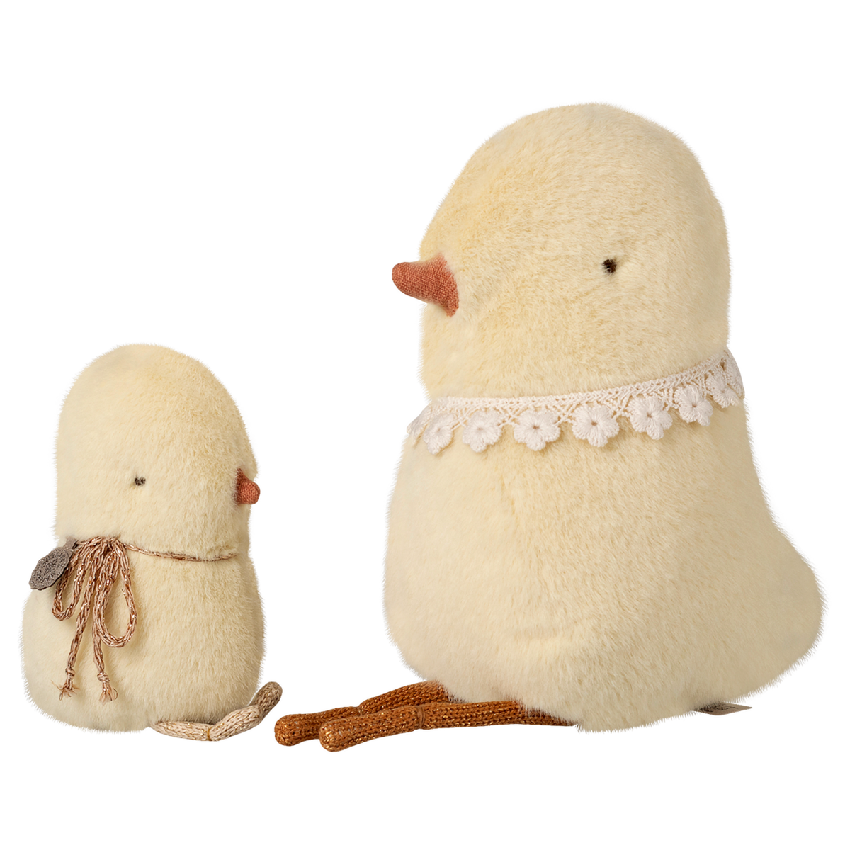 Two plush bird toys on a white background: a small chick with a scarf and a larger bird with a lace collar, both in soft, pale yellow fabric.