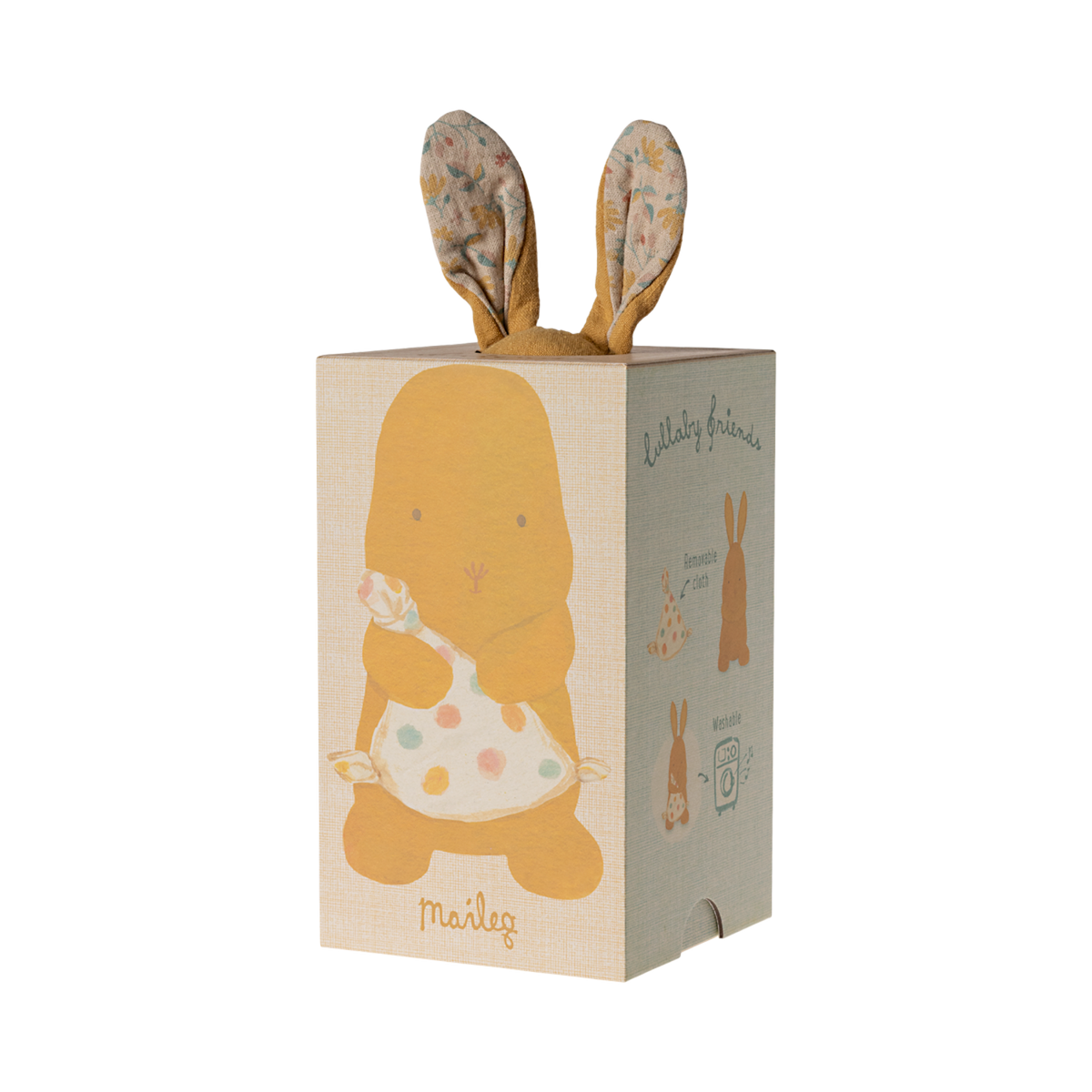 A soft, brown stuffed bunny with patterned fabric ears sits holding a white, polka-dotted blanket. The cozy scene conveys warmth and comfort.