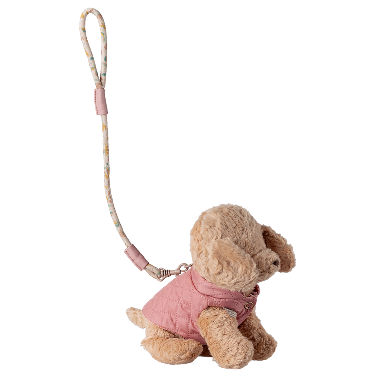 Plush dog keychain wearing a pink quilted jacket, attached to a floral-patterned strap. Set against a white background, conveying a cute, stylish vibe.