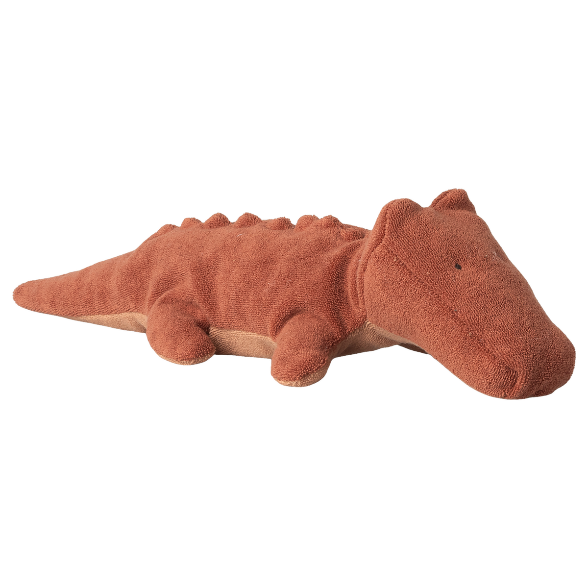A soft, brown plush crocodile toy with a textured surface and small limbs, lying on a white background. The toy conveys a calm, friendly demeanor.
