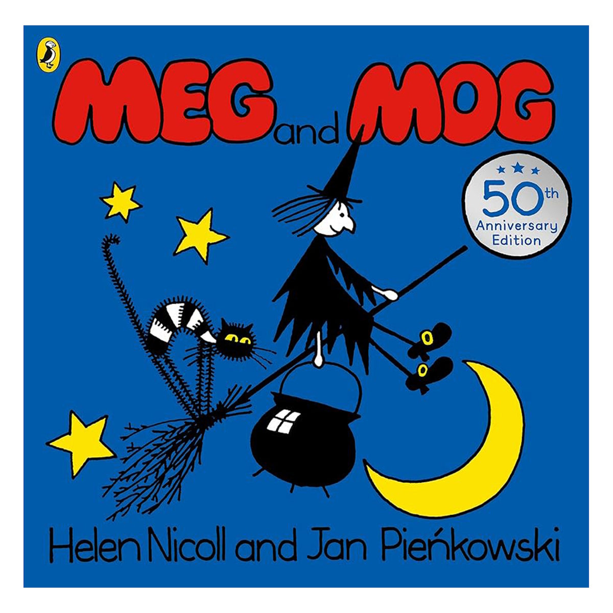 A witch on a broomstick flies over a crescent moon, accompanied by a black cat and a cauldron. Bright stars accent the blue background. The cover reads "Meg and Mog, 50th Anniversary Edition."