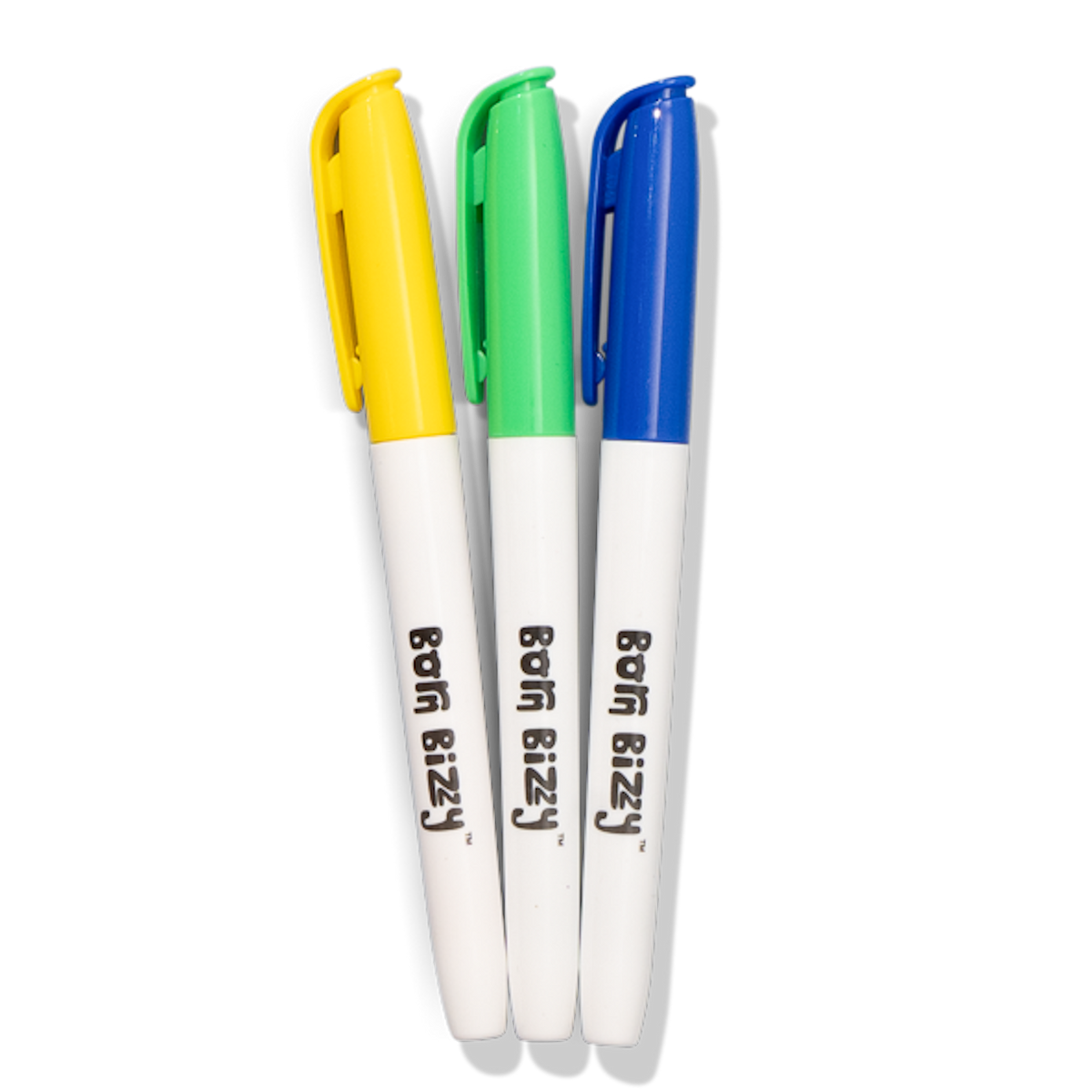 Three "Born Bizzy" marker pens with white barrels and caps in yellow, green, and blue against a white background.