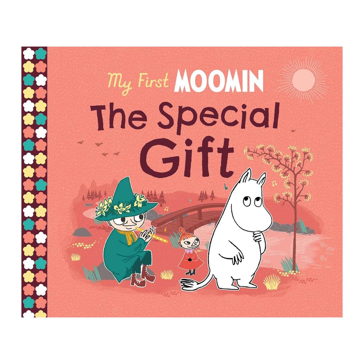 Cover of "My First Moomin: The Special Gift" shows Moomin, Little My, and Snufkin sitting on grass by a bridge with a pink sky and sun. Whimsical tone.