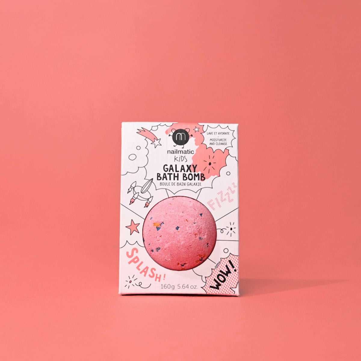 A colorful pink bath bomb package labeled "Galaxy Bath Bomb" on a pink background. The packaging features playful graphics like stars and rockets, conveying a fun and youthful vibe.