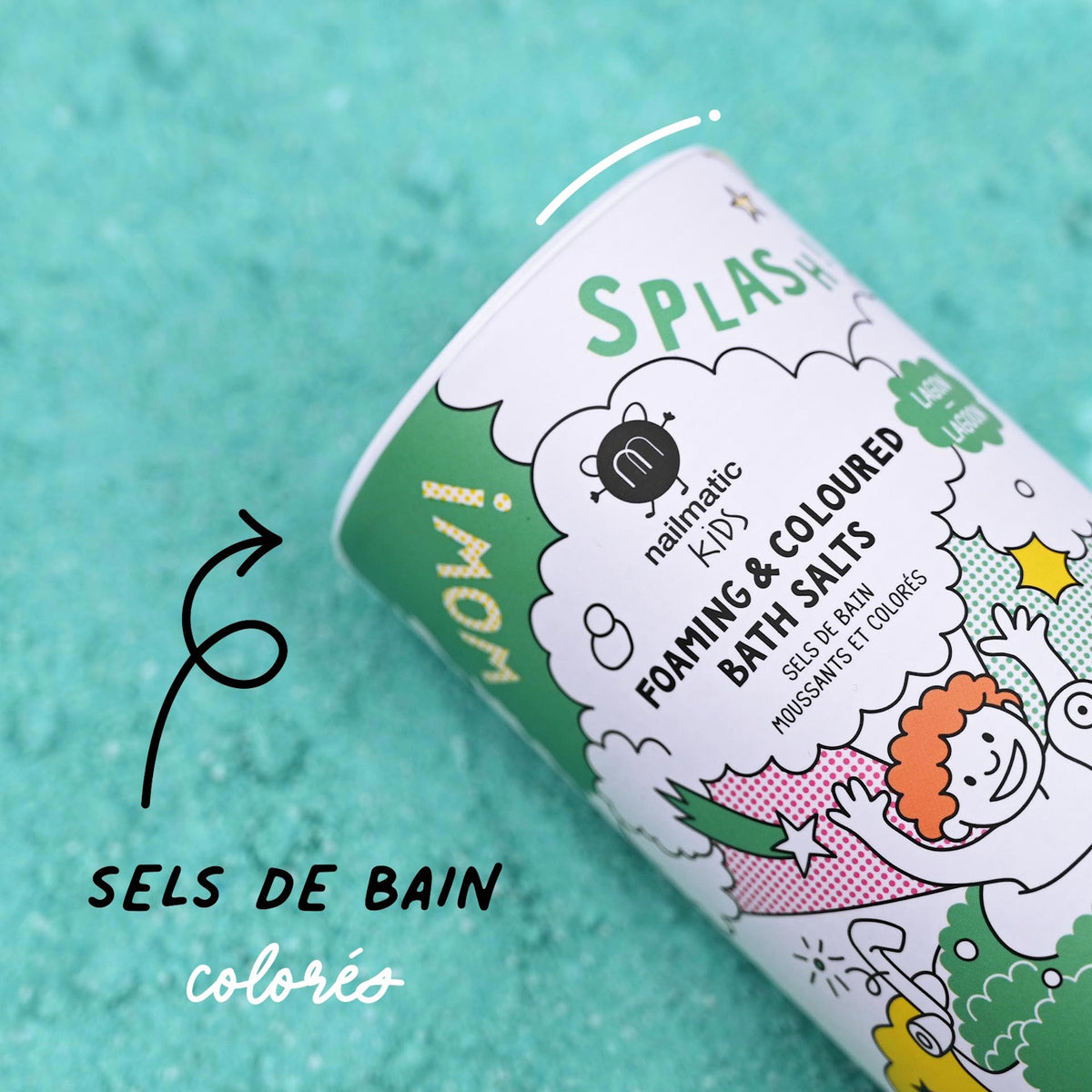 A colorful package of "foam and colored bath salts" lies on a teal-textured background. The playful design includes cheerful cartoon illustrations.