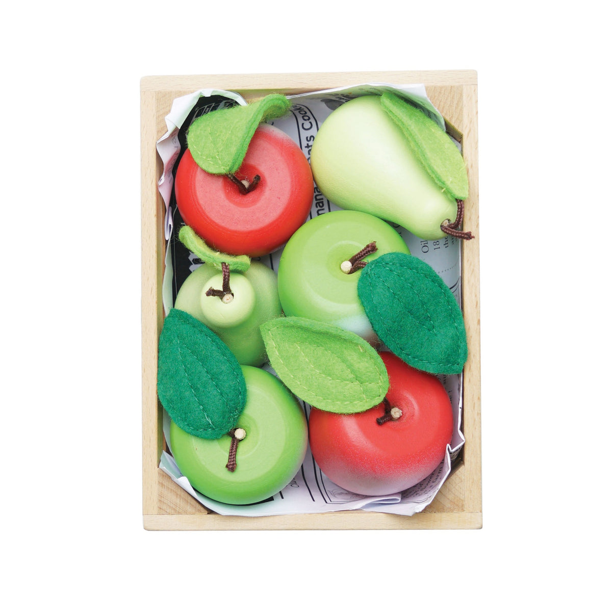 Top-down view of a wooden crate packed with toy apples and pears with felt leaves.
