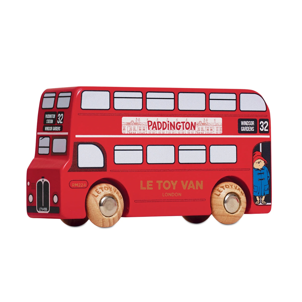 A red wooden toy London double-decker bus featuring Paddington Bear branding and wooden wheels.