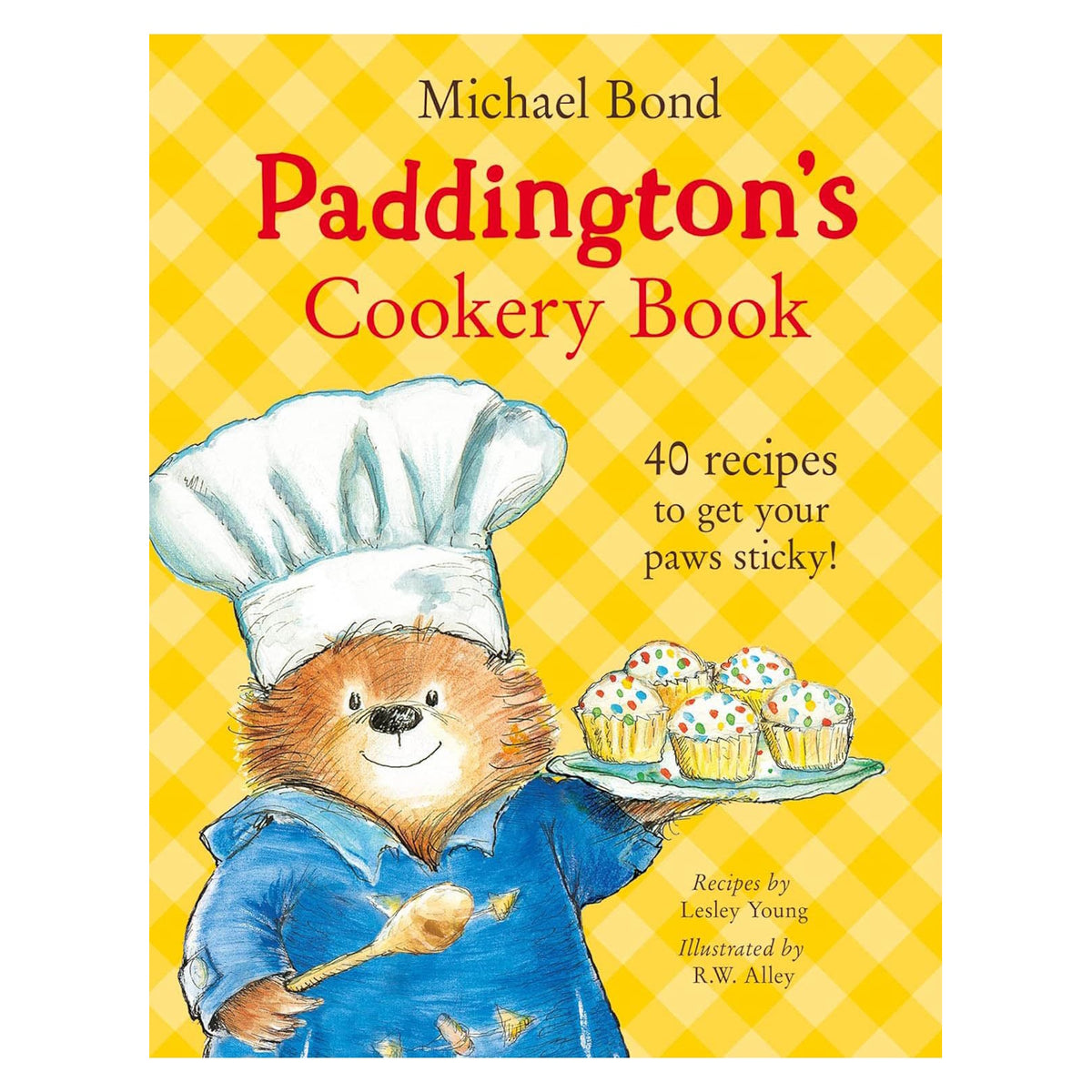 Paddington Bear in chef hat holding cupcakes, cover of Paddington's Cookery Book by Michael Bond.
