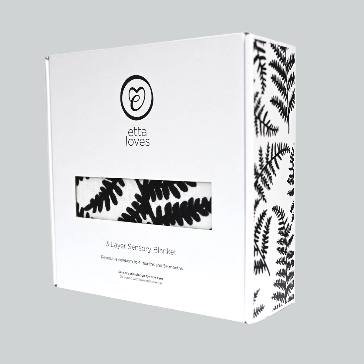 White packaging box for an Etta Loves 3 Layer Sensory Blanket with a fern pattern preview window.