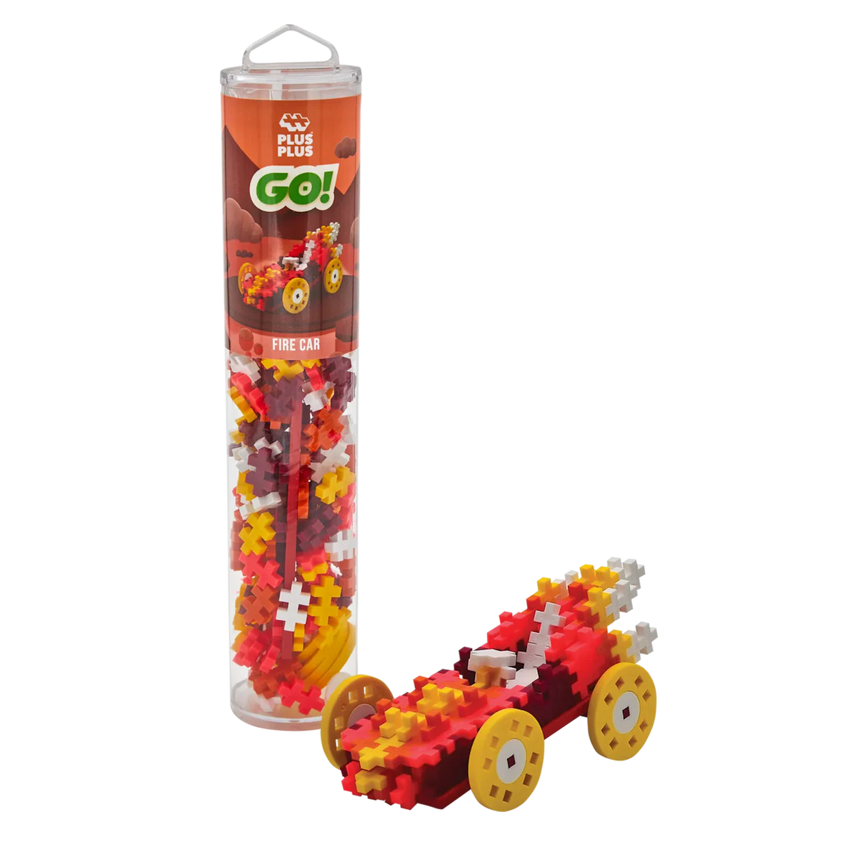 Toy building kit with red, yellow, and white puzzle pieces forming a model car with large yellow wheels. The packaging is a tall, clear tube labeled "Fire Car."
