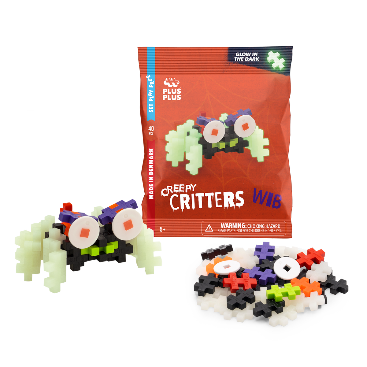 Package of Plus-Plus "Creepy Critters" featuring glow-in-the-dark pieces, shown with a partially assembled creature in colorful plastic blocks.