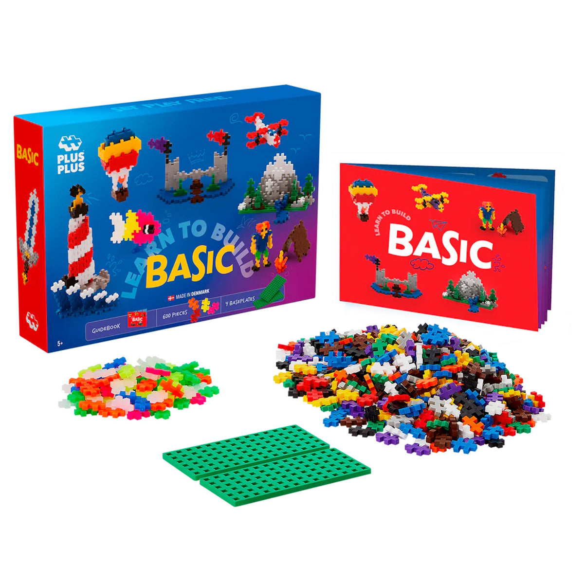 Plus-Plus Learn to Build Basic 600-piece set with building bricks, green baseplates, and instructional guidebook.