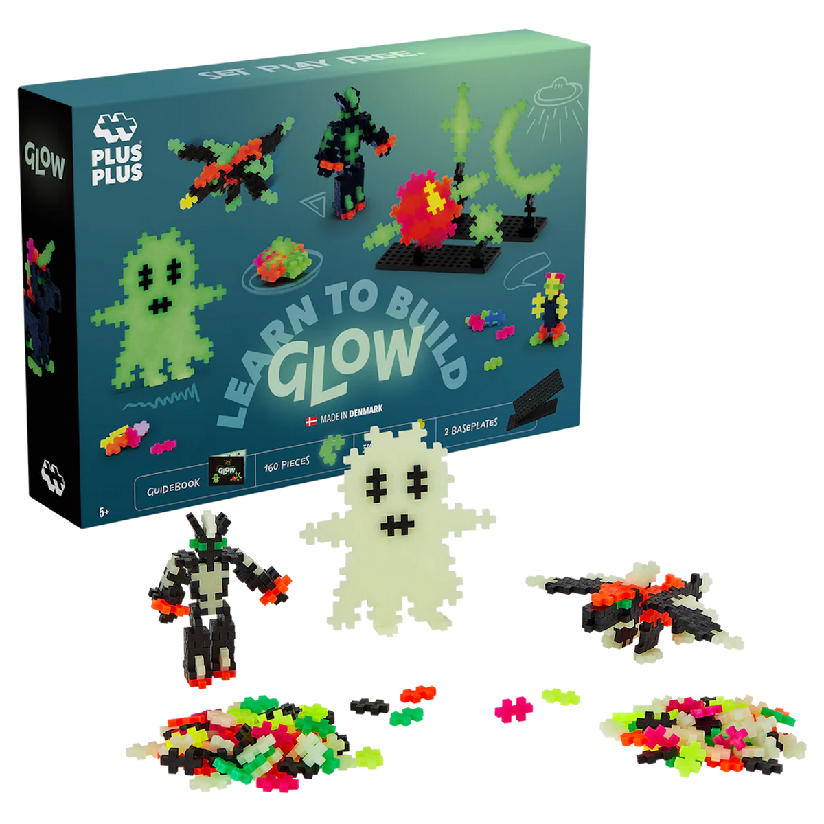 Toy set box with "Learn to Build Glow" kit. Includes 160 bright, glowing pieces forming figures like a ghost and alien, against a white background.