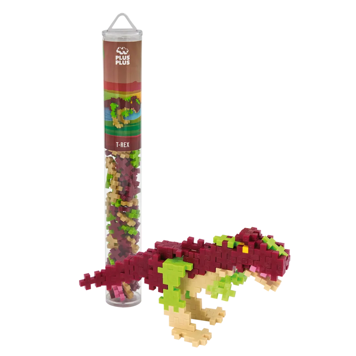Building set package containing small, interlocking pieces next to a T-Rex dinosaur model made of pink, green, and beige pieces, against white background.