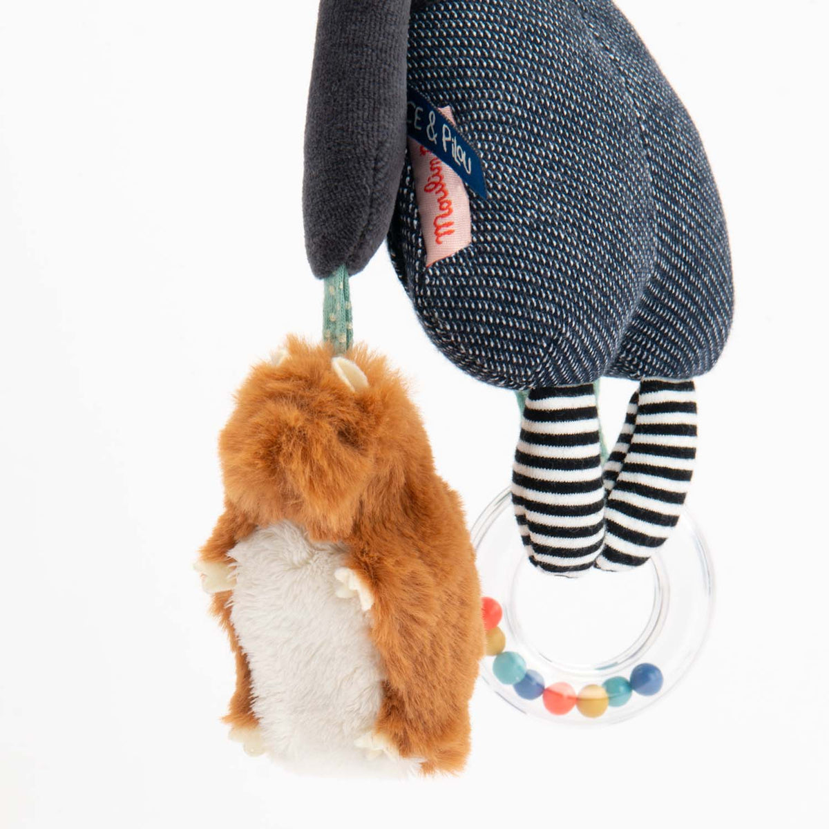 Plush Puce and Pilou hanging activity dog toy with a fluffy brown squirrel and clear rattle ring.