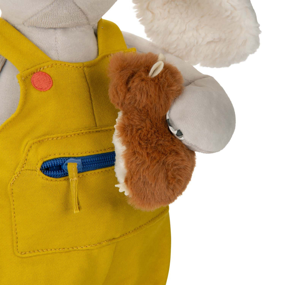 Close up of plush activity dog toy wearing yellow overalls with zippered pocket and holding a small brown mouse.