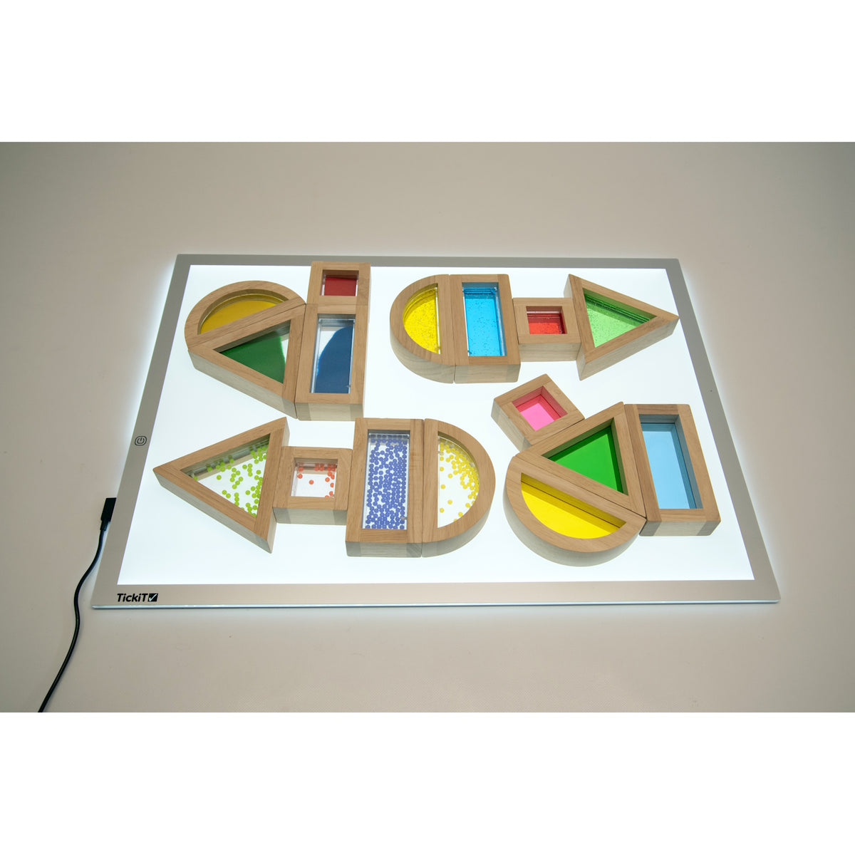A set of wooden blocks with different textures, sounds, and visual elements, designed to engage children's senses and support early development.
