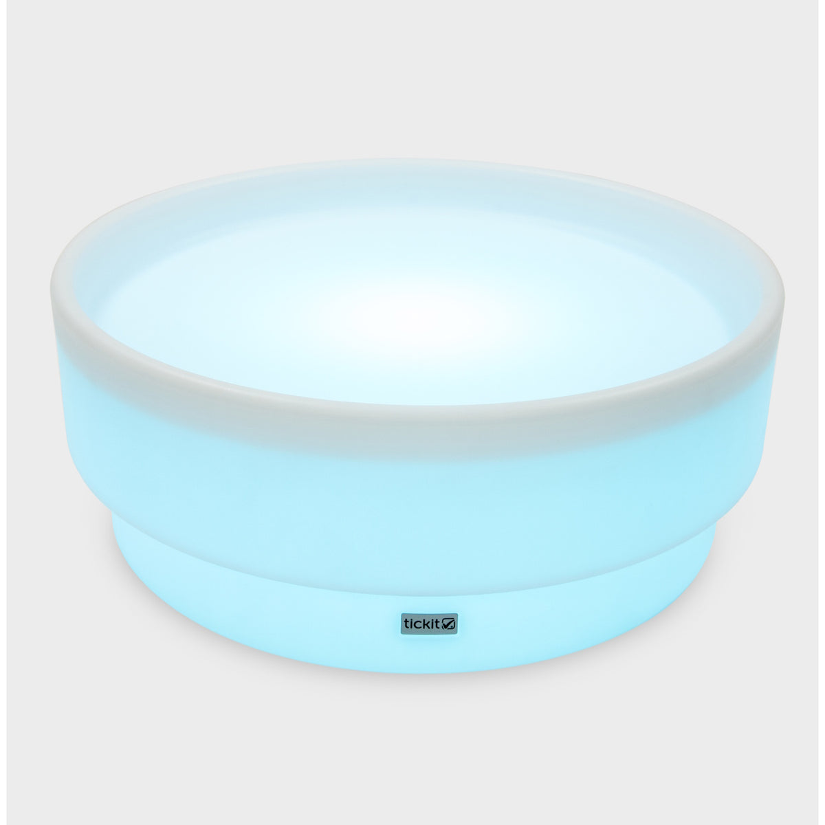 A softly glowing LED table with a shallow well, designed for sensory exploration, water play, and immersive learning experiences.