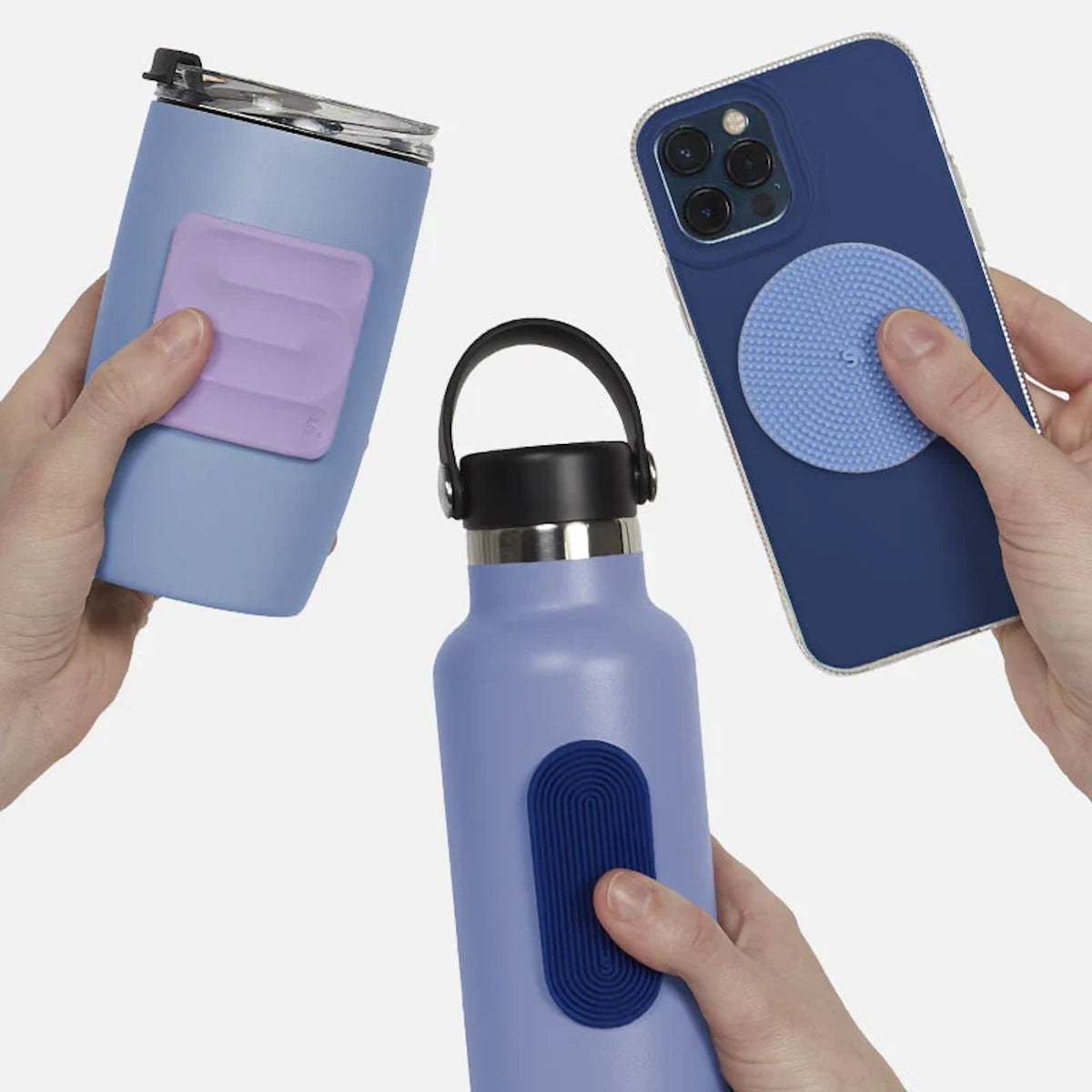 Hands holding blue items with textured silicone sensory stickers attached.