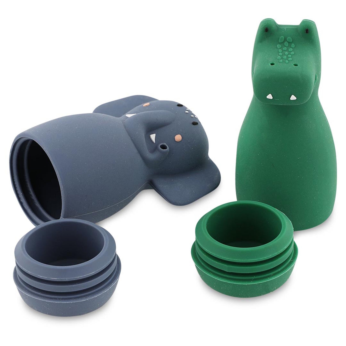 Two silicone animal-shaped containers, one green and one blue, rest with lids off, revealing stackable cups. The design is playful and whimsical.