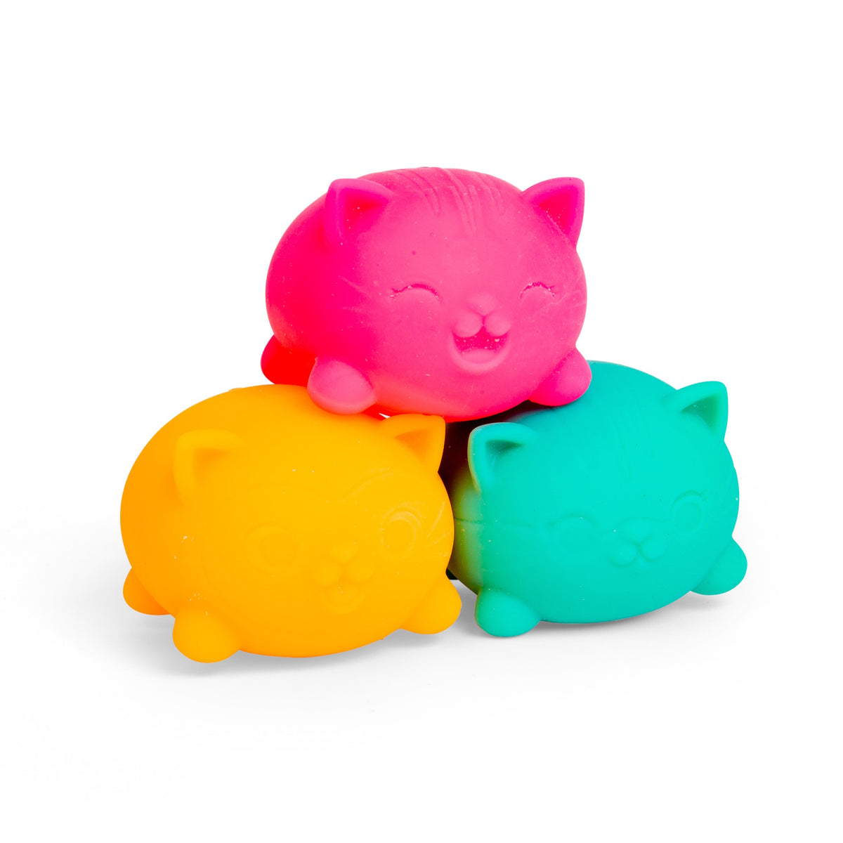 Three Teenie NeeDoh Cool Cats squishy stress toys in neon pink, orange, and teal stacked in a pile on a white background.