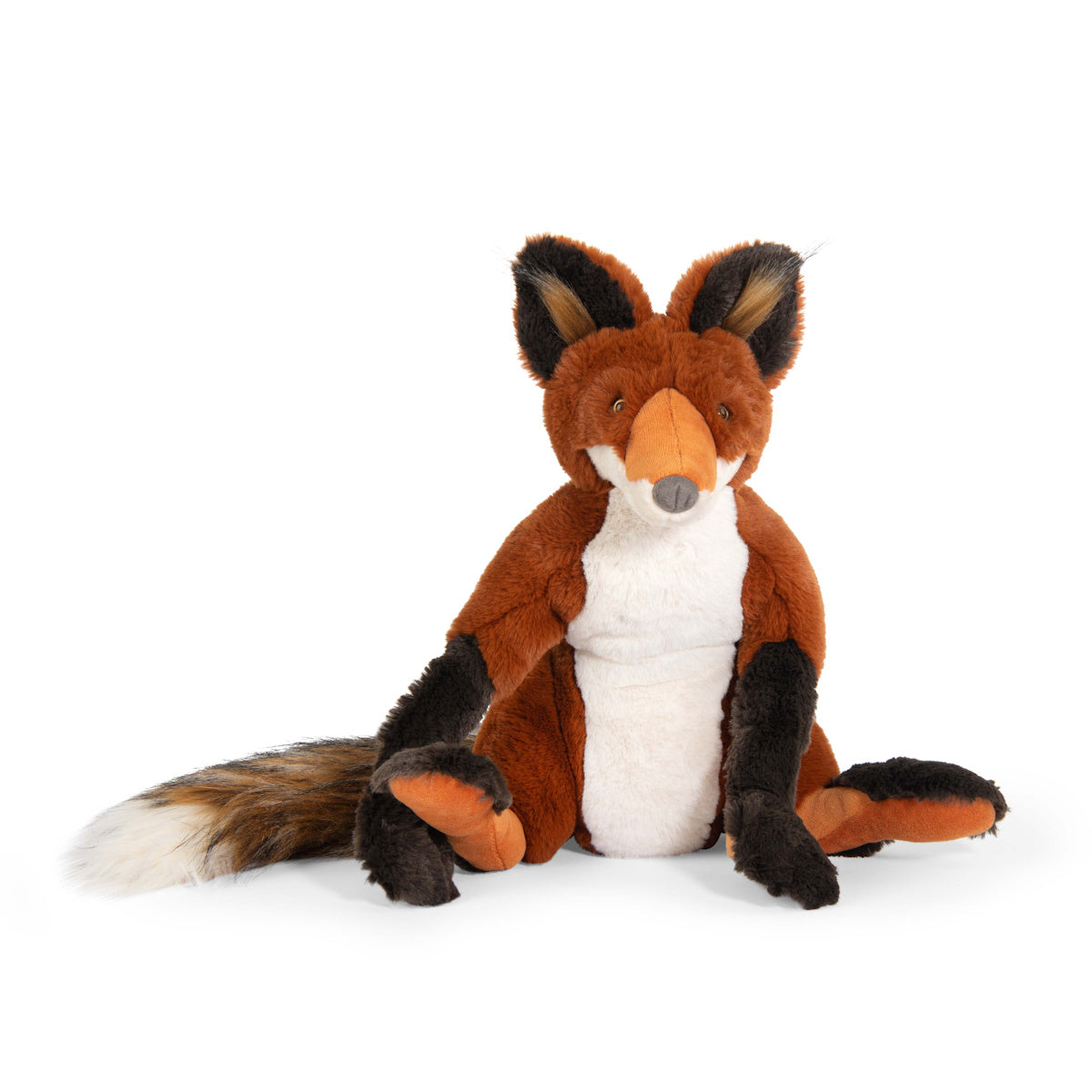 A plush fox toy sits upright on a white background. It has orange fur, a white belly, and dark brown paws. The fox's expression is friendly and playful.