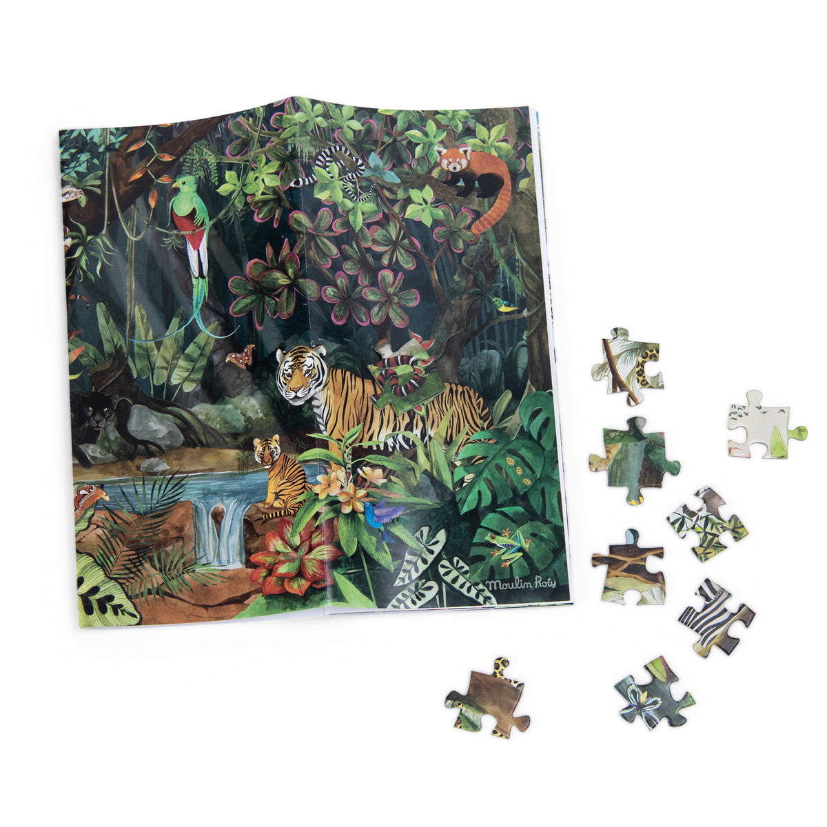 Moulin Roty rainforest puzzle poster and loose pieces featuring a tiger, red panda, and exotic birds.