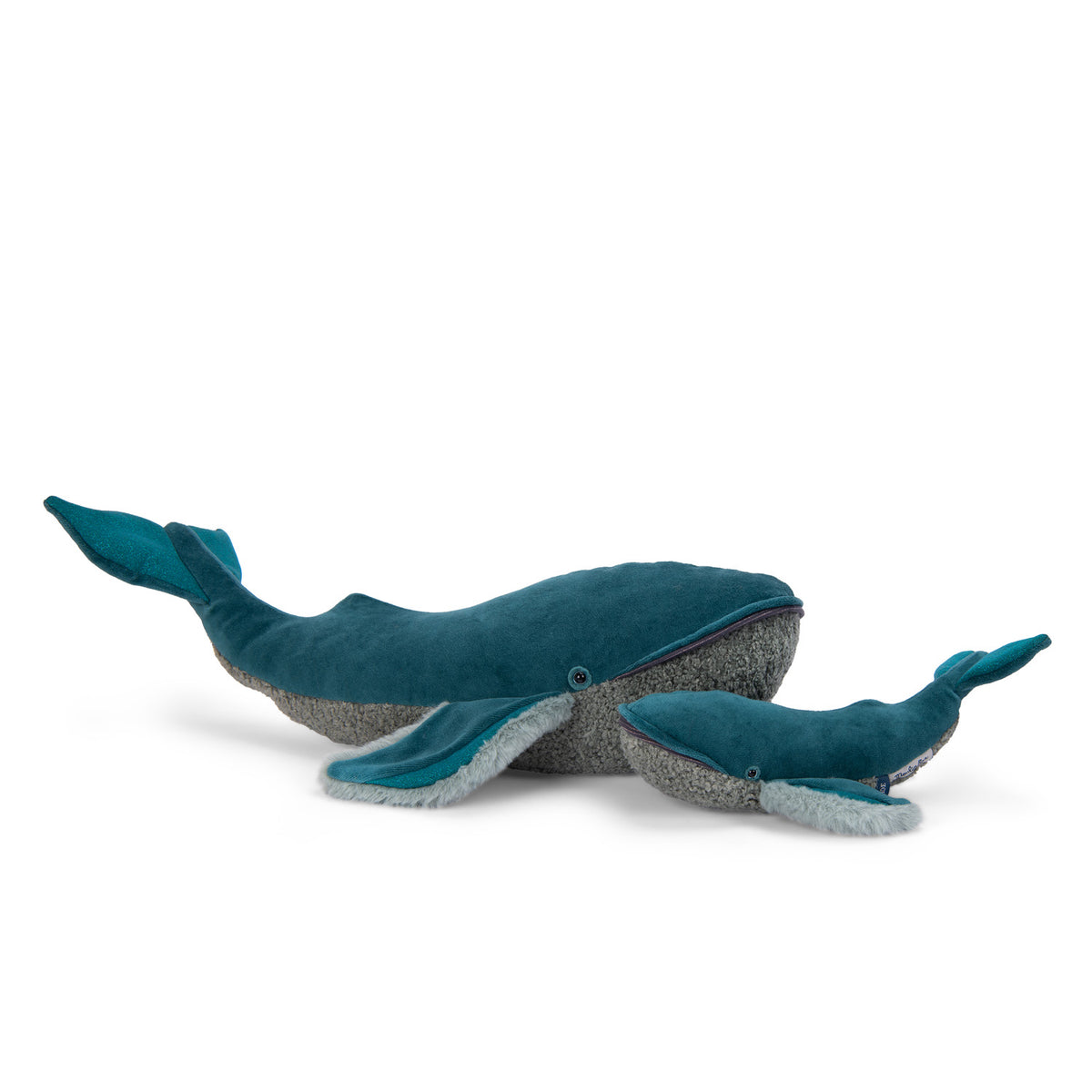 Two plush whale toys, one large and one small, in teal velvet and grey textured fabric from the Tout Autour Du Monde collection.