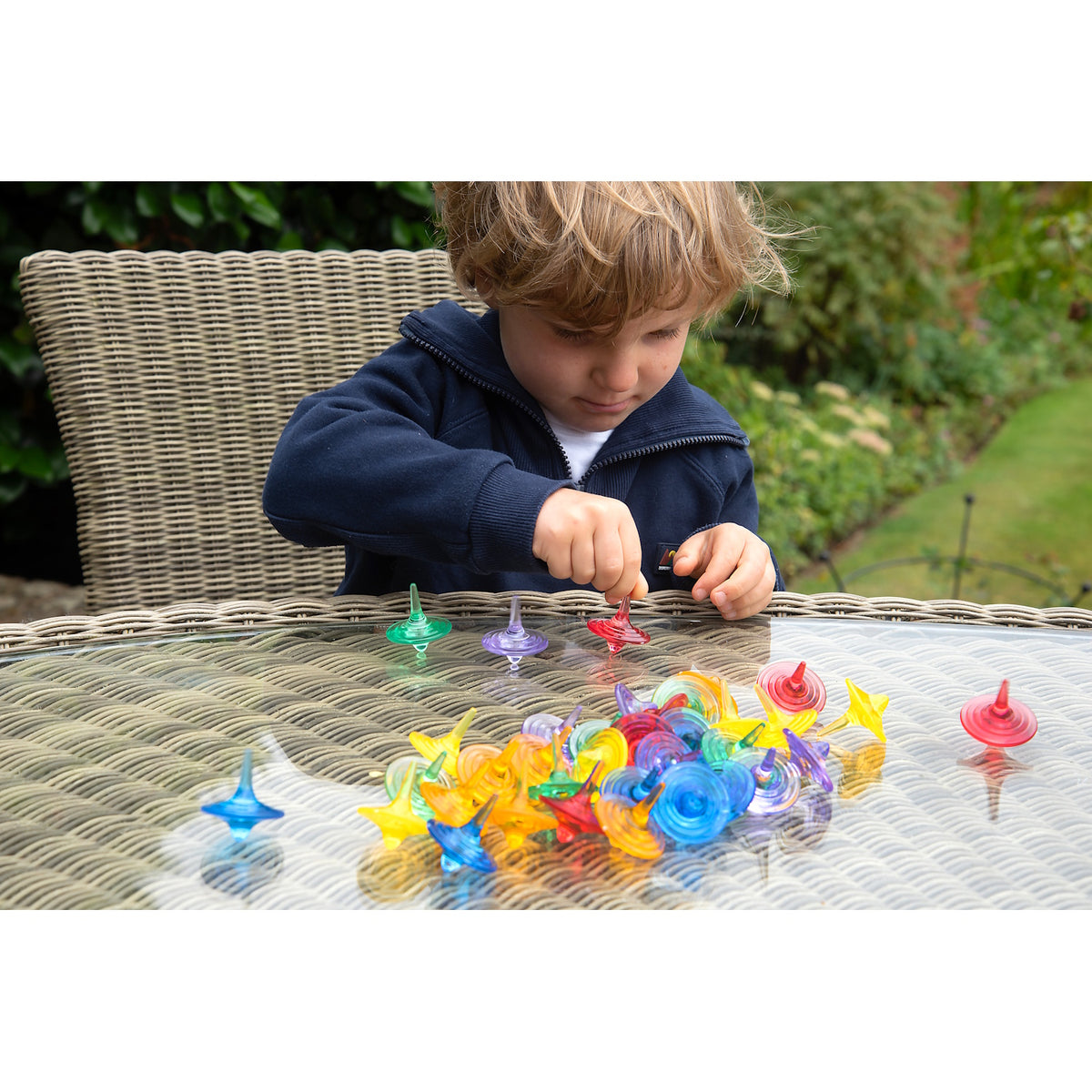 A set of spinning sensory toys with clear, colorful discs that create visual effects, ideal for exploring color mixing and motion.