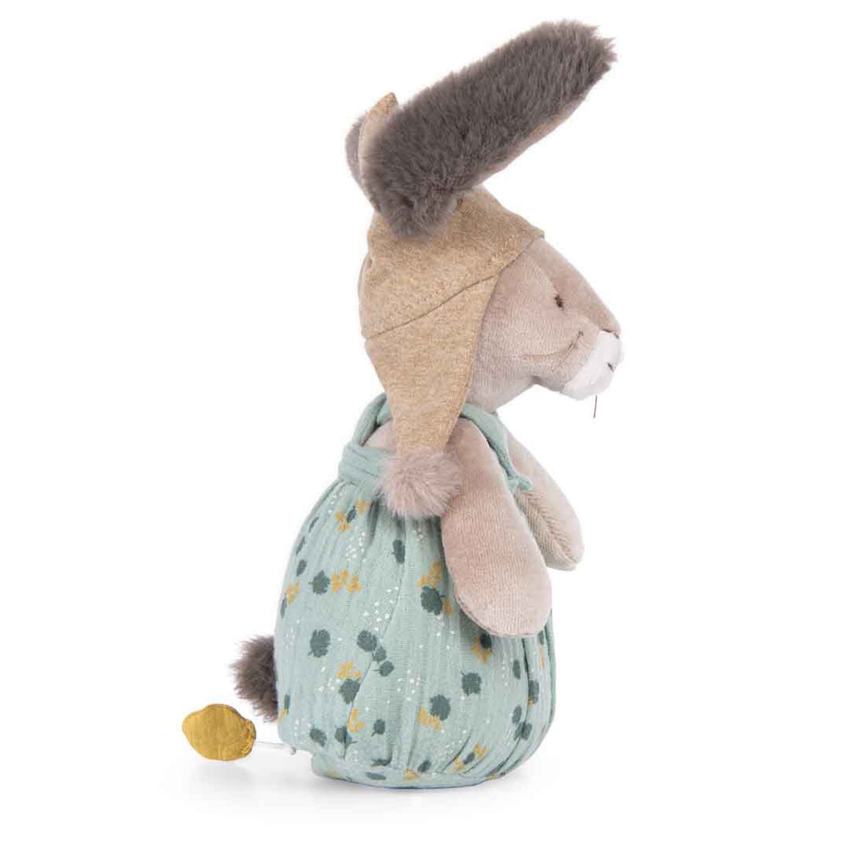 Side profile of a plush rabbit wearing a pointed tan hood and green floral overalls against a white background.