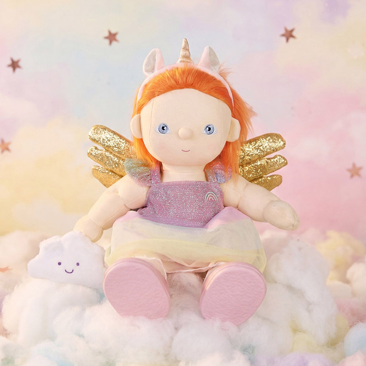 Plush fairy unicorn doll with orange hair and gold wings sitting on clouds.
