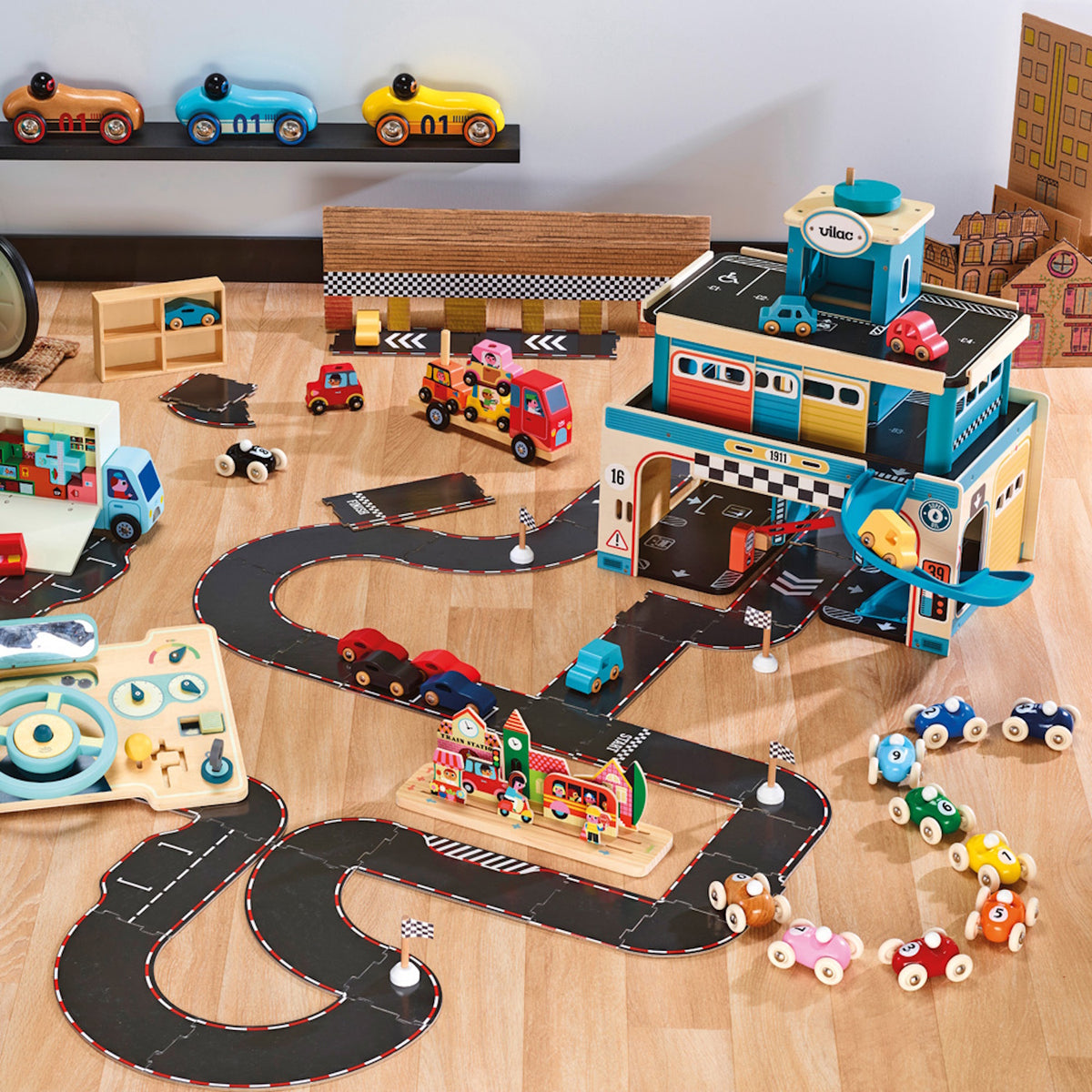 Vilac wooden toy car set with multi-story garage, flexible race track, and colorful miniature cars on a wooden floor.