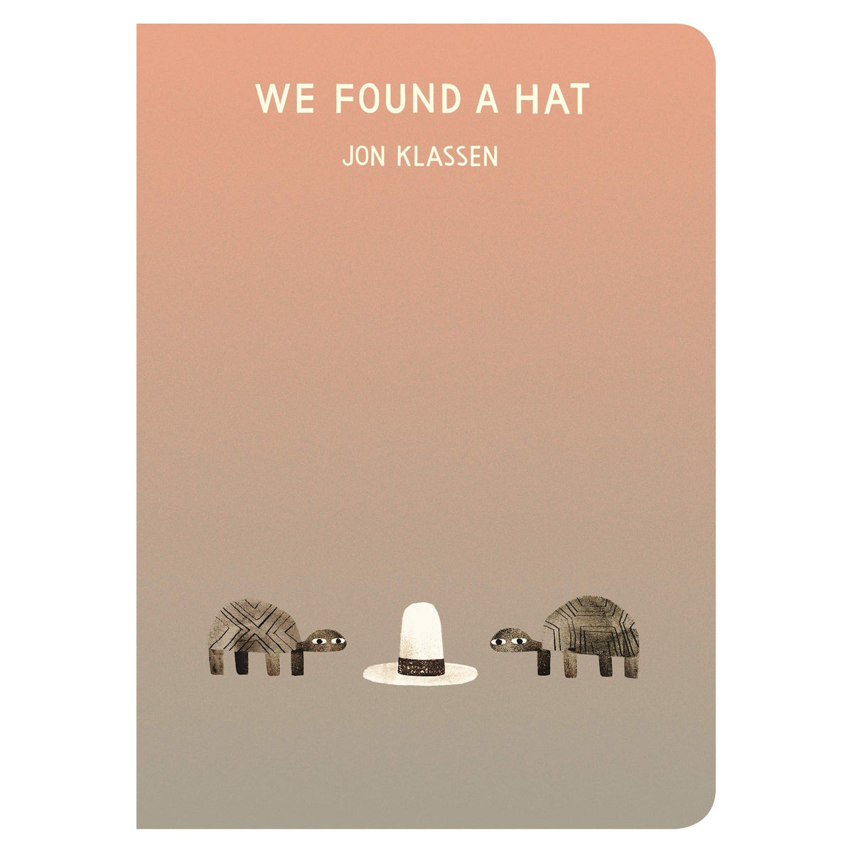 Book cover for We Found a Hat by Jon Klassen featuring two turtles looking at a tall white hat on a tan gradient background.