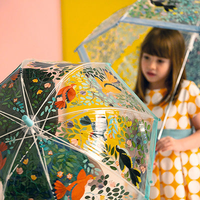 two-girls-underneath-two-Djeco-childrens-umbrellas-chatting