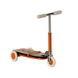 Maileg mouse kickboard scooter in bright orange with cream wheels and handlebars.